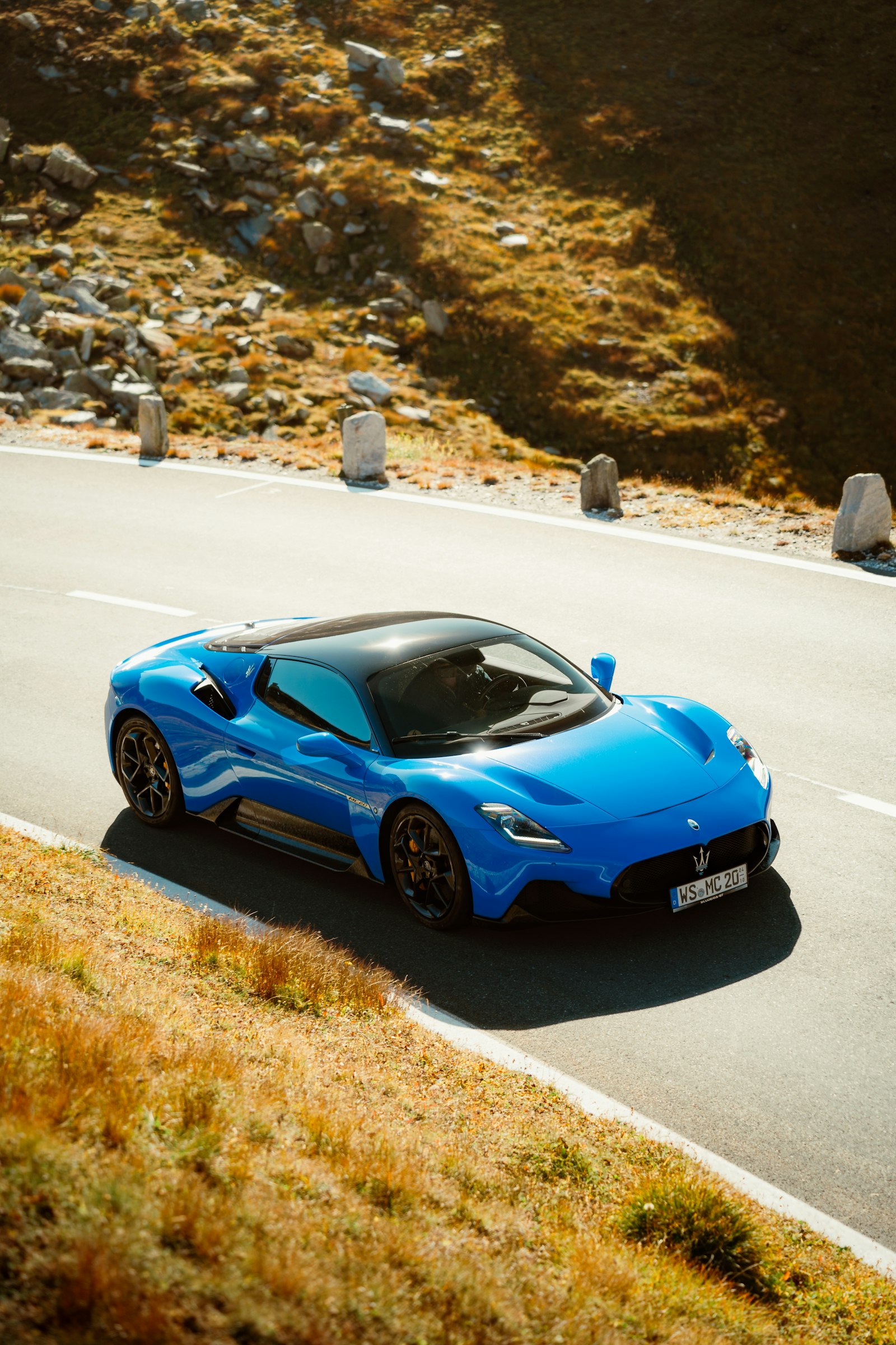 A supercar on a mountain pass