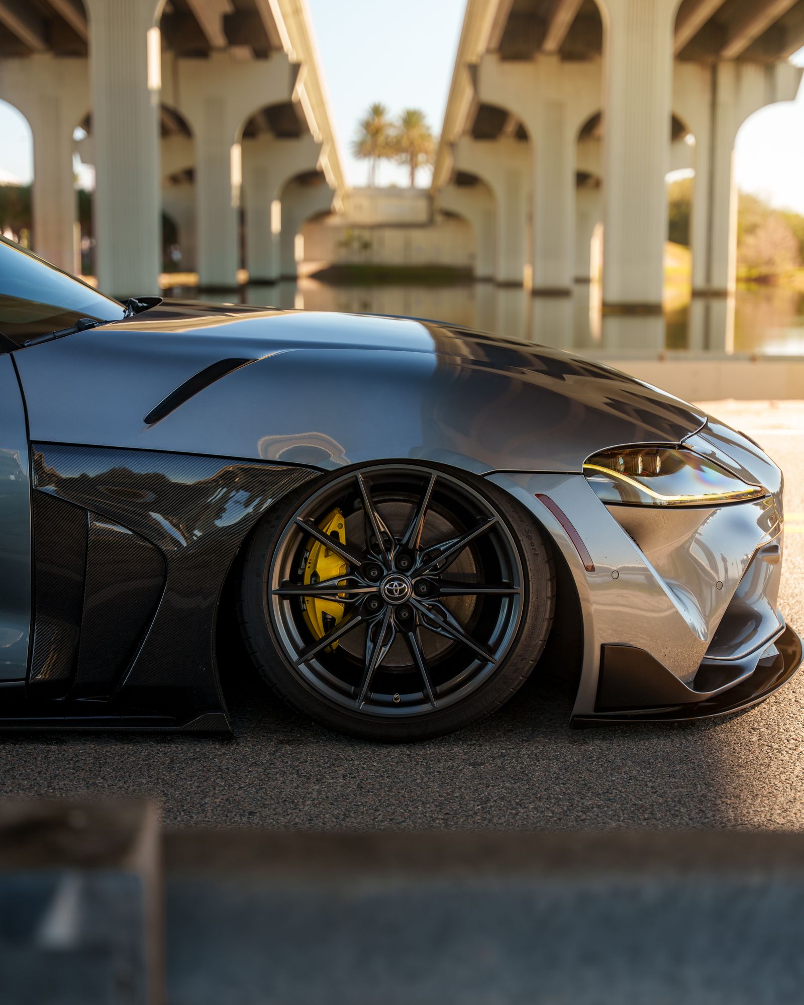 A modified sports car under architectural light