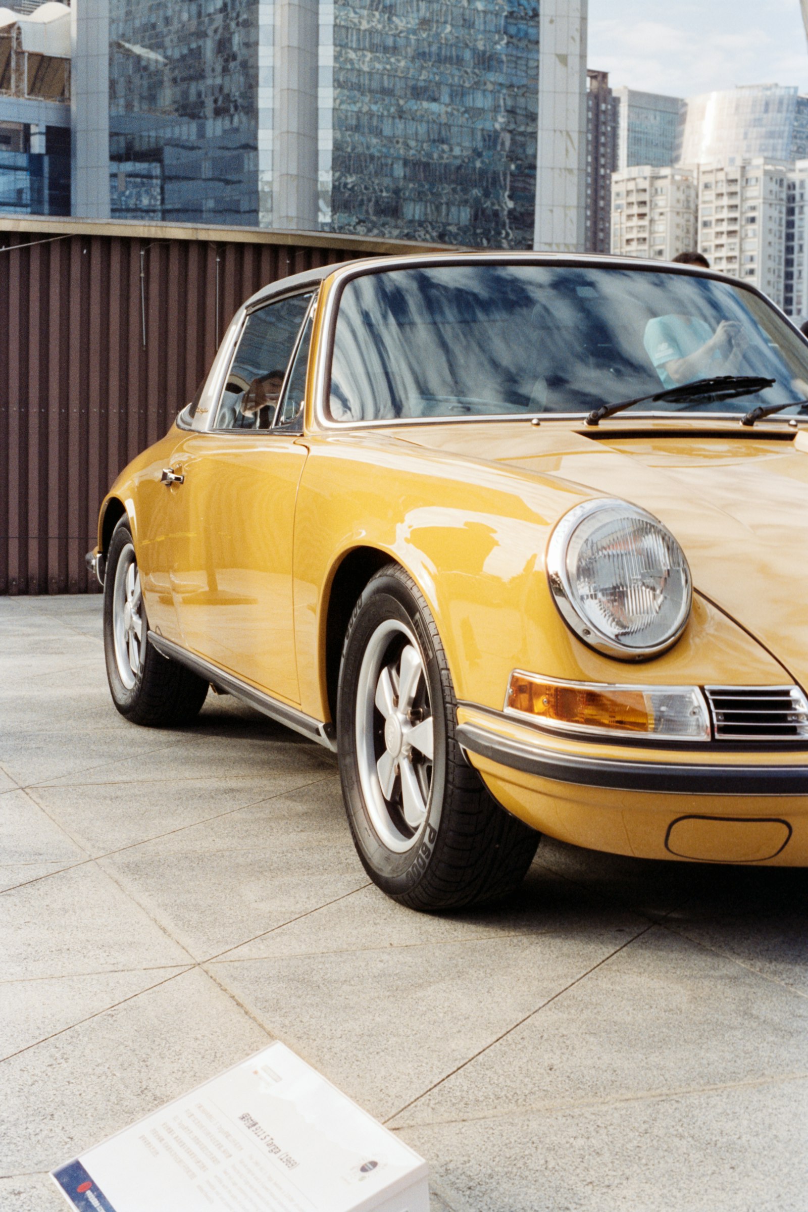 A classic sports car in warm daylight