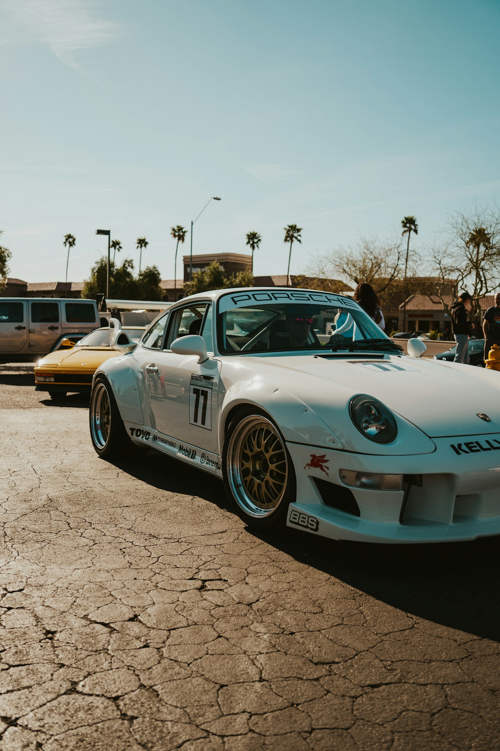 A white sports car in bright sunshine